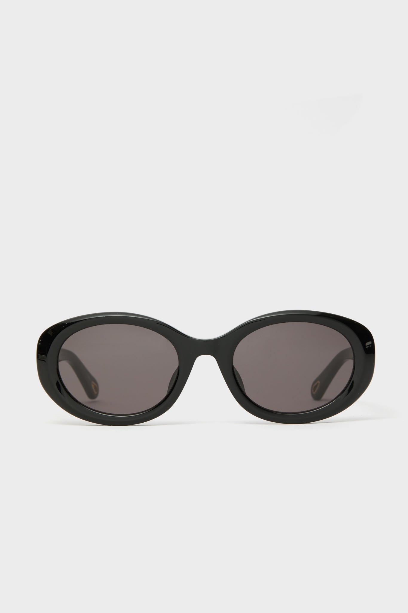 Chloe Marcie black oval sunglasses featuring dark lenses, designed for effortless style.