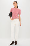 Model wears the Dusty Rose Brushed Merino Wool Puff Sleeve Lexie Sweater, paired with classic ivory jeans and high-end suede boots, exuding an effortless and fun style.