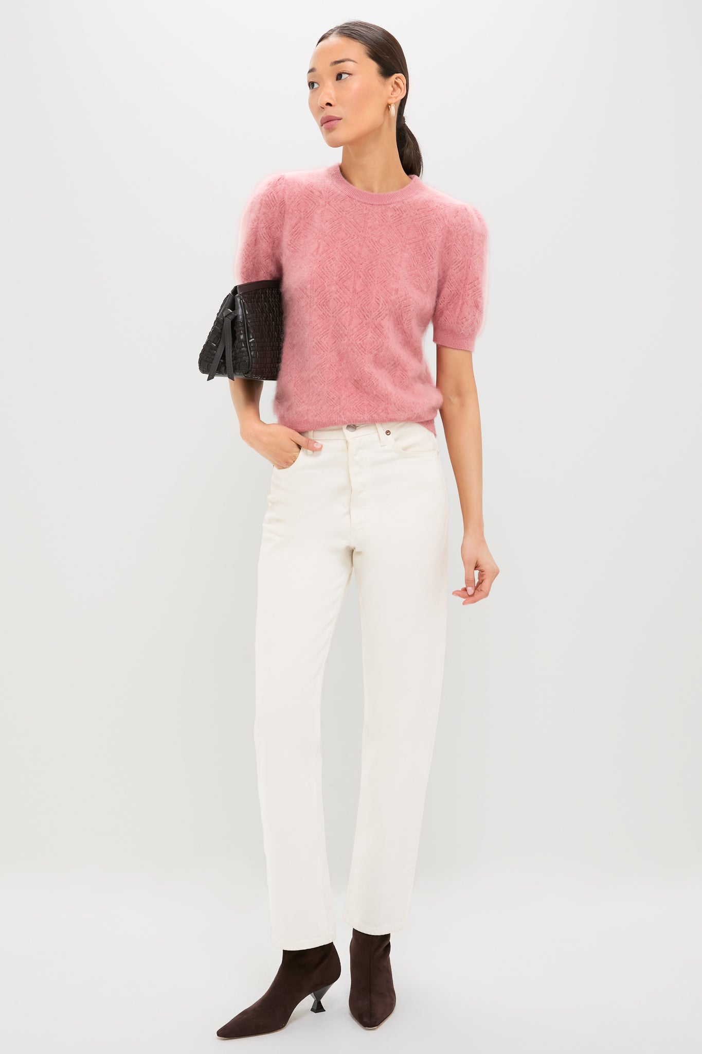 Model wears the Dusty Rose Brushed Merino Wool Puff Sleeve Lexie Sweater, paired with classic ivory jeans and high-end suede boots, exuding an effortless and fun style.