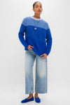 Model wearing the classic Blue Cocha Sweater, effortlessly styled with wide-leg jeans and cobalt loafers, showcasing a fun, high-end look.