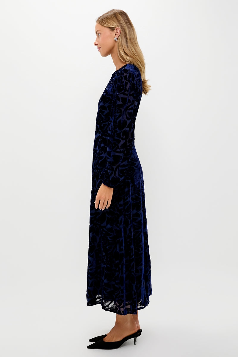 Navy Burnout Velvet Odette Maxi Dress on model; classic, effortless style with long blouson sleeves, fitted bodice, and flowing skirt for high-end, fun occasions.