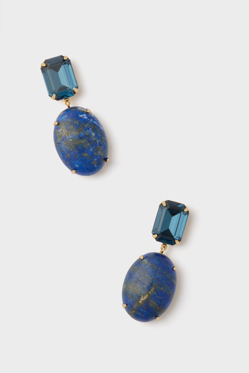 A pair of Jennifer Behr Lapis Xiomara Earrings, featuring rectangular dark blue stones atop oval blue stones with gold flecks, all set in gold-plated metal. These handmade earrings highlight elegant craftsmanship.
