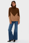 Young woman models a classic Tan & Brown Diamond Demi Turtleneck, effortlessly styled with high-waisted jeans and pointed-toe shoes, embodying fun, high-end casual elegance.
