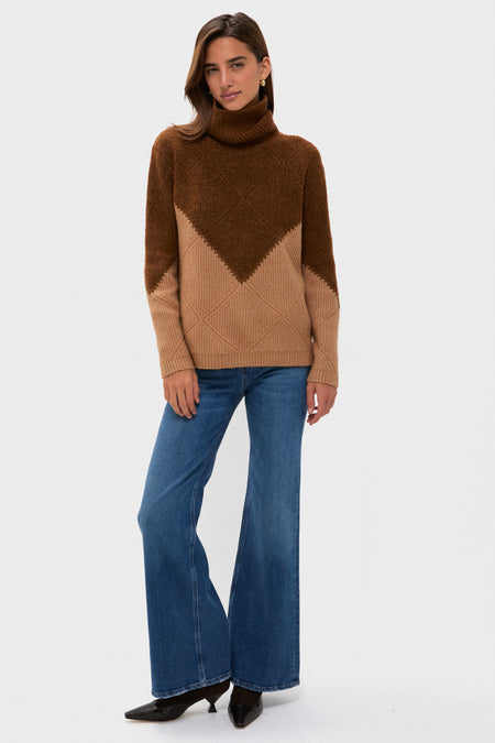 Young woman models a classic Tan & Brown Diamond Demi Turtleneck, effortlessly styled with high-waisted jeans and pointed-toe shoes, embodying fun, high-end casual elegance.