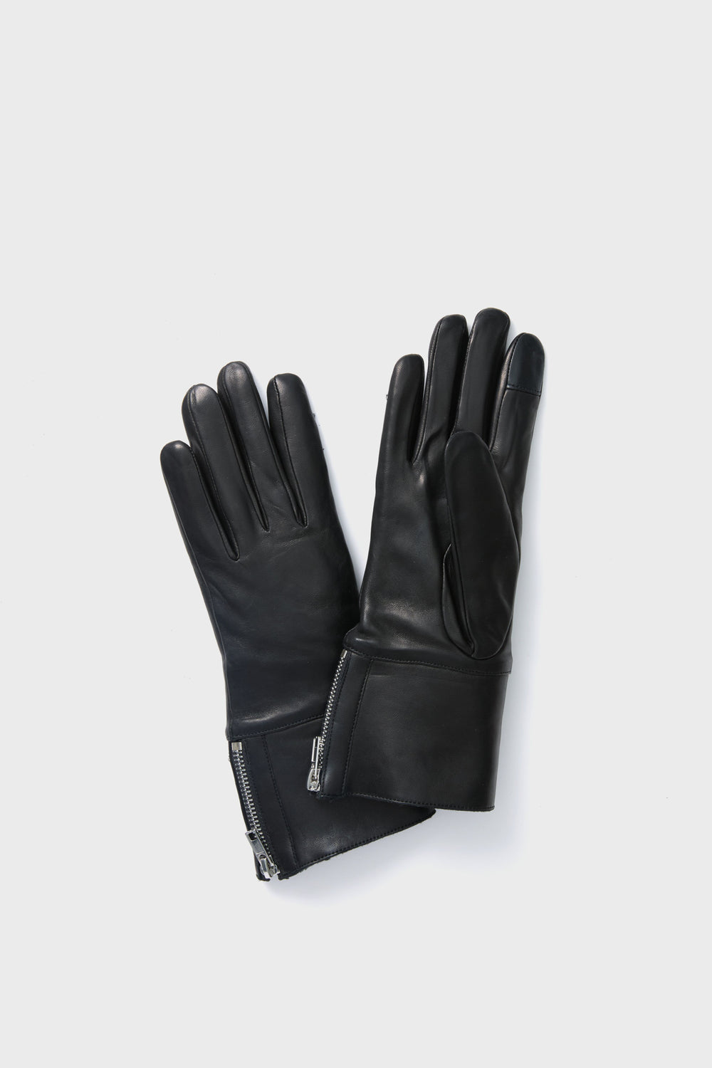 Carolina Amato black leather gloves with wrist zippers, designed to be touchscreen compatible for style and functionality.