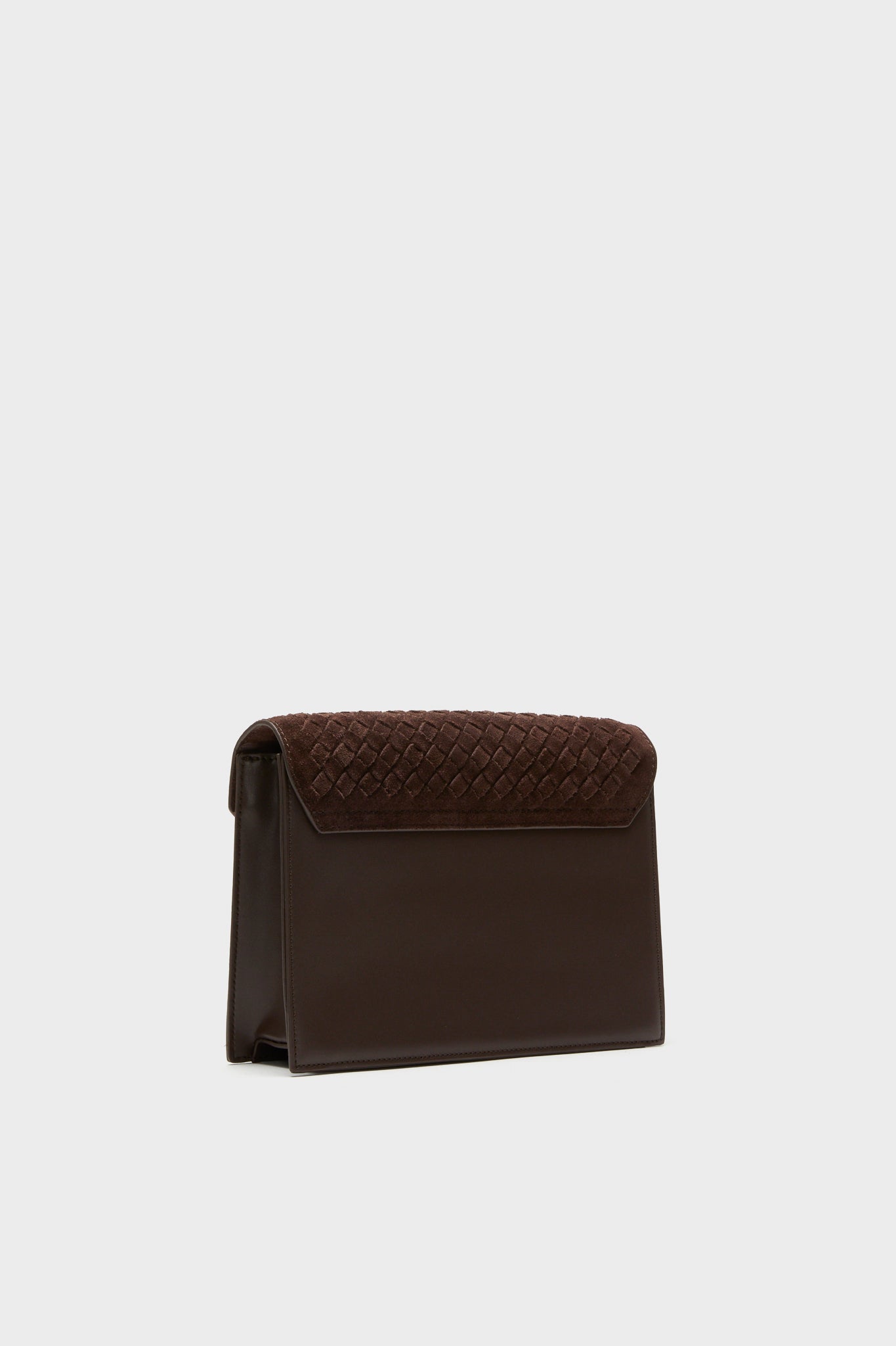 Brown Leather Stevie Crossbody features an effortless, high-end design with a classic woven suede flap, perfect for a fun, stylish addition to any fall outfit.