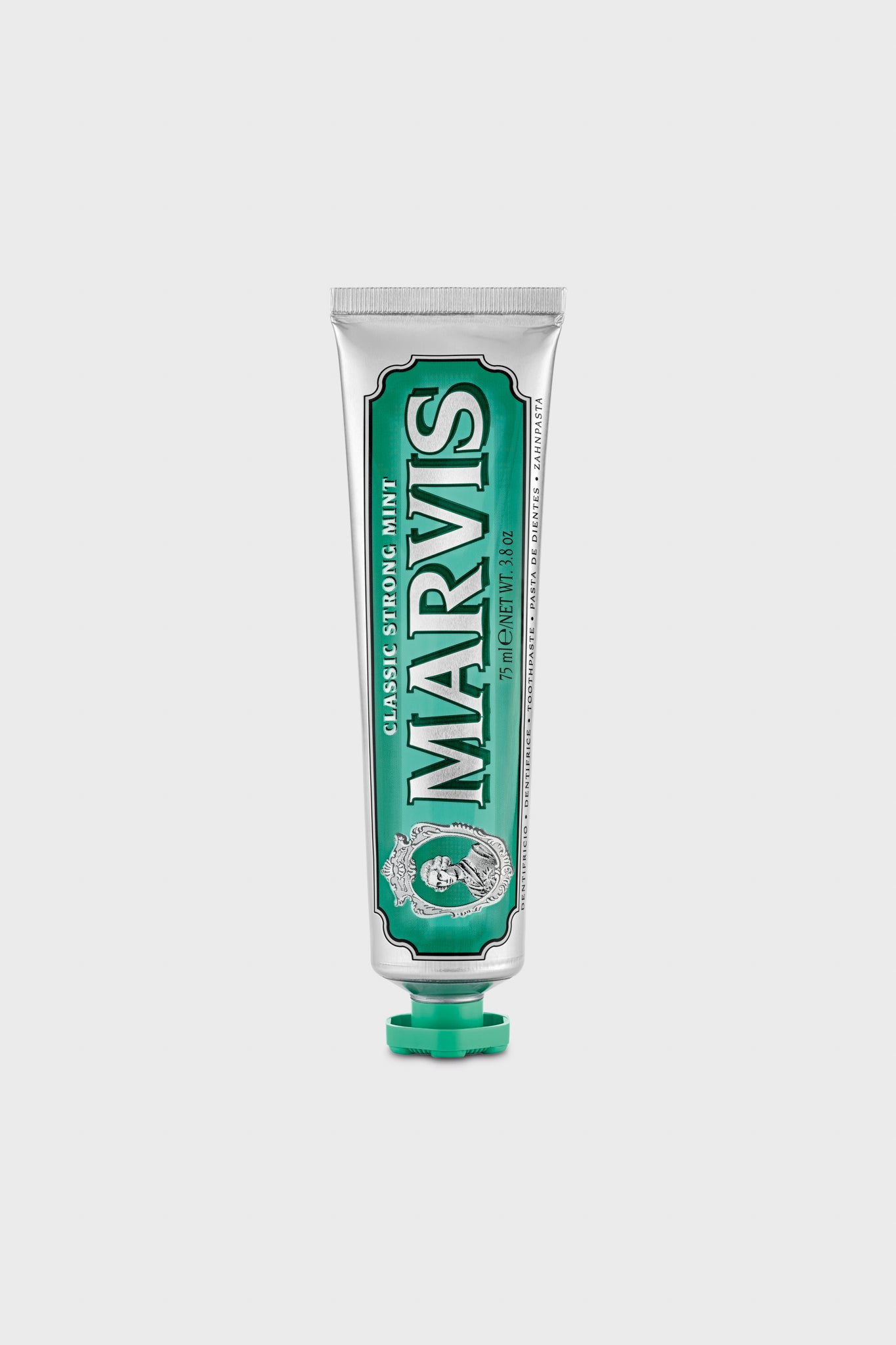A tube of Marvis Classic Strong Mint Toothpaste stands upright with a green cap, delivering luxury dental care and long-lasting minty freshness.