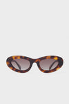 Anine Bing oval sunglasses featuring a tortoiseshell pattern, dark lenses, and polarized UV400 protection.