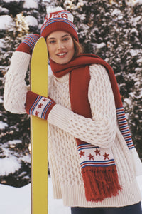 Young person outdoors, wearing the USA Salt Lake Scarf with star motifs. Effortlessly cool and classic, this high-end piece perfectly complements winter adventures.