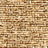 Close-up view of a textured surface made of small, rectangular tan and light brown bricks arranged in a horizontal pattern.