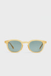 Illesteva yellow-framed round acetate sunglasses featuring dark green tinted lenses.