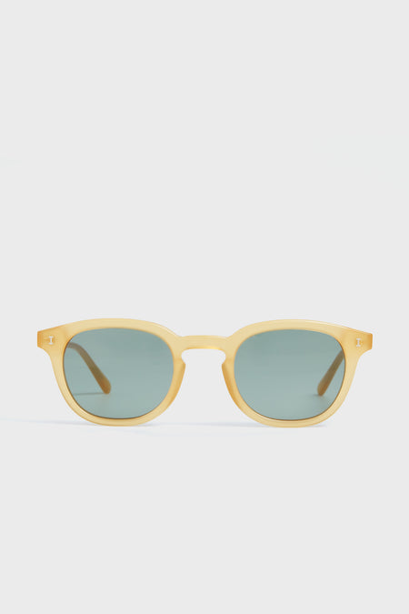 Illesteva yellow-framed round acetate sunglasses featuring dark green tinted lenses.
