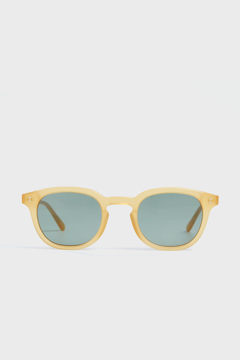 Illesteva yellow-framed round acetate sunglasses featuring dark green tinted lenses.