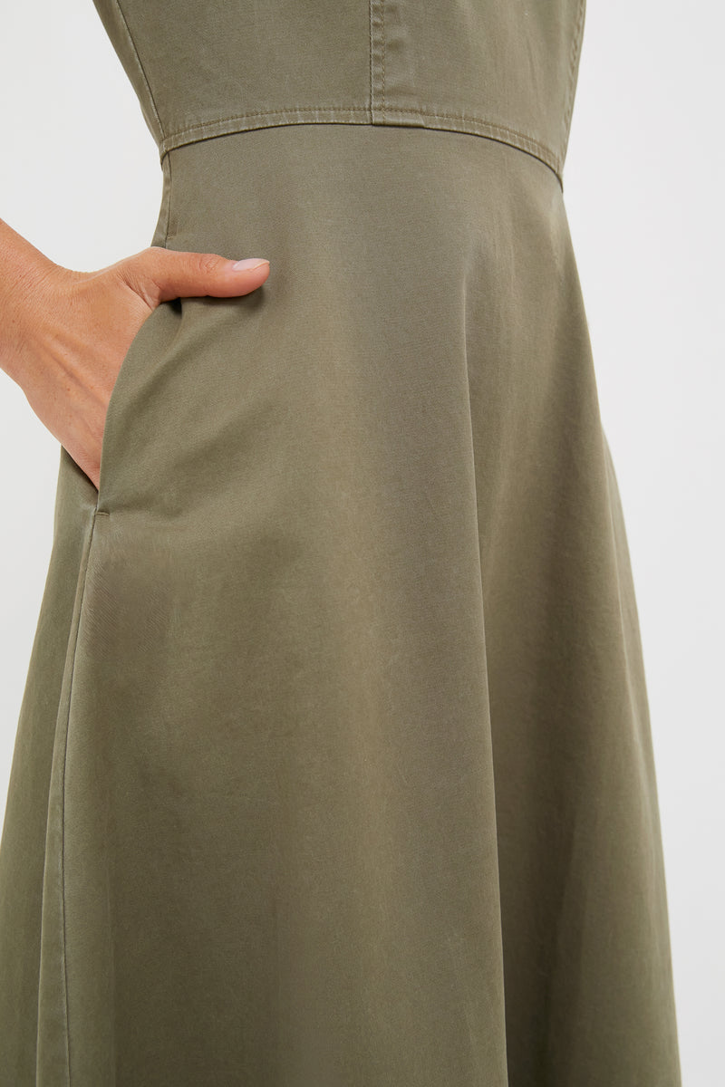 Close-up of the Burnt Olive Chino Solen Midi Dress featuring a classic A-line silhouette, hidden side pocket, and waist seam, embodying effortless, high-end style.