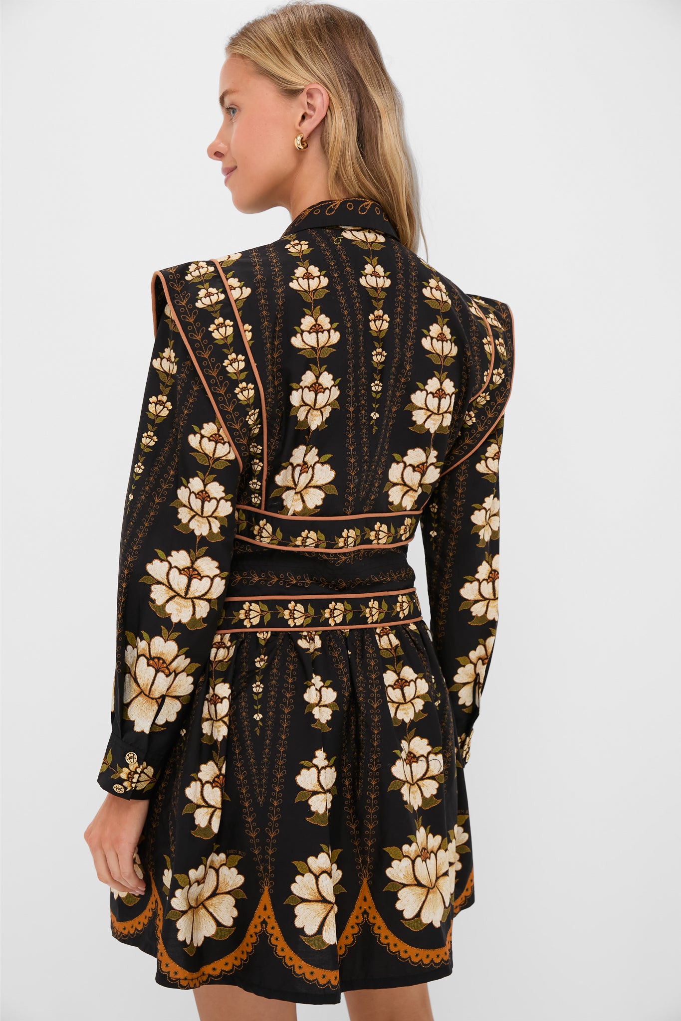 Back view of a woman in a classic, high-end Black Embroidered Flowers Topstitching Long Sleeve Mini Dress, showcasing an effortless, fun style with bold floral motifs.