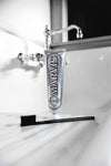 Marvis Whitening Mint toothpaste stands elegantly by a classic sink, paired with a sleek toothbrush, offering an effortless, high-end dental care experience.