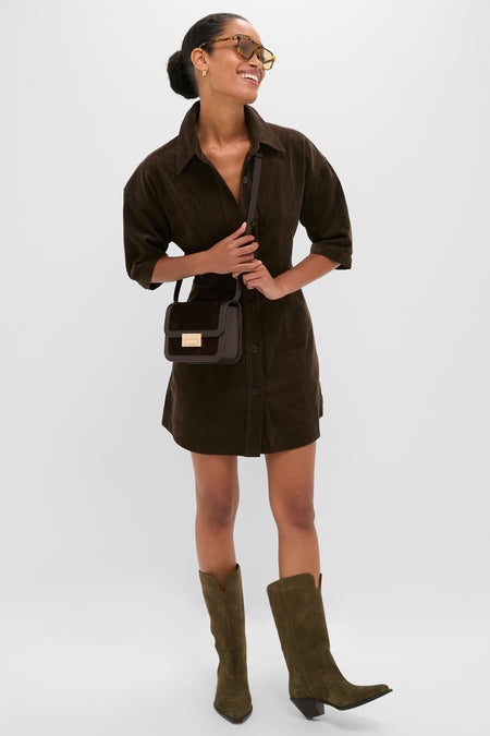 Model showcasing the classic Tmoro Suede Desi Crossbody Bag, featuring effortless style with gold hardware, flap design, and adjustable strap for a high-end, fun look.