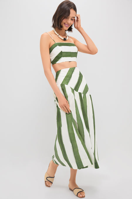 Woman models classic Green Stripe Nature Midi Skirt, featuring an effortless drop waist and fun A-line silhouette, paired with matching top and high-end accessories.