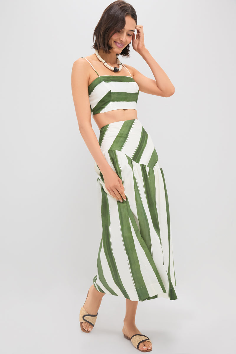 Woman models classic Green Stripe Nature Midi Skirt, featuring an effortless drop waist and fun A-line silhouette, paired with matching top and high-end accessories.