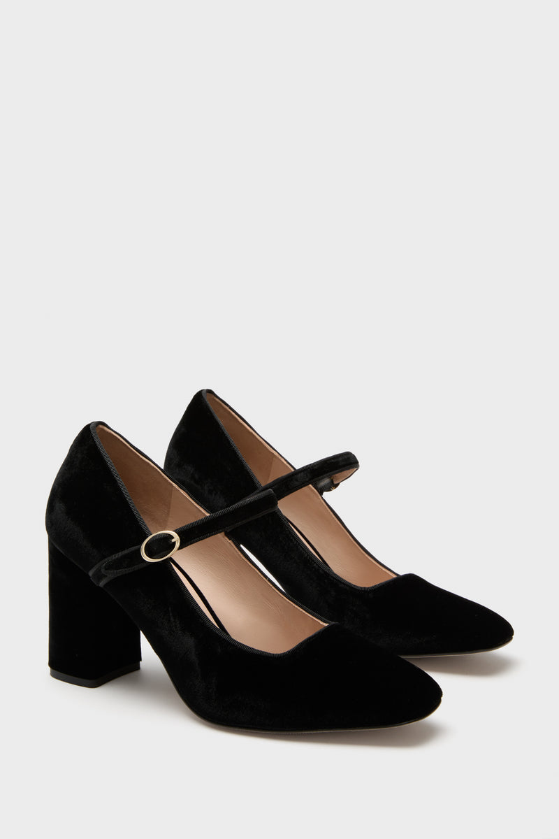 Black Velvet Julia Heels, classic Mary-Jane pumps with a rounded toe, block heel, and gold-tone buckle. Effortless elegance, perfect for fun, high-end styling.