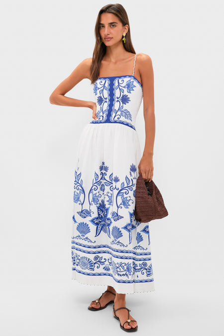 Model showcasing Multi Tesori Fish Charm Drop Earrings with a classic white sundress, exuding an effortless, fun, and high-end look, perfect for any occasion.