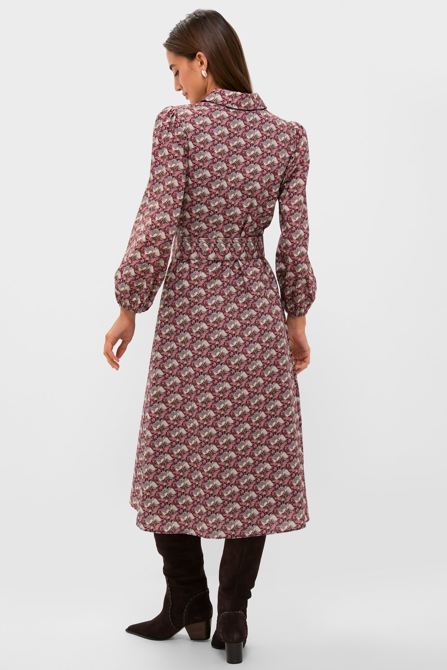 Woman wearing the classic Plum & Dusty Blue Leafy Floral Kai Maxi Dress with a fitted waist, fold-over collar, and knee-high boots, exuding effortless, high-end style.
