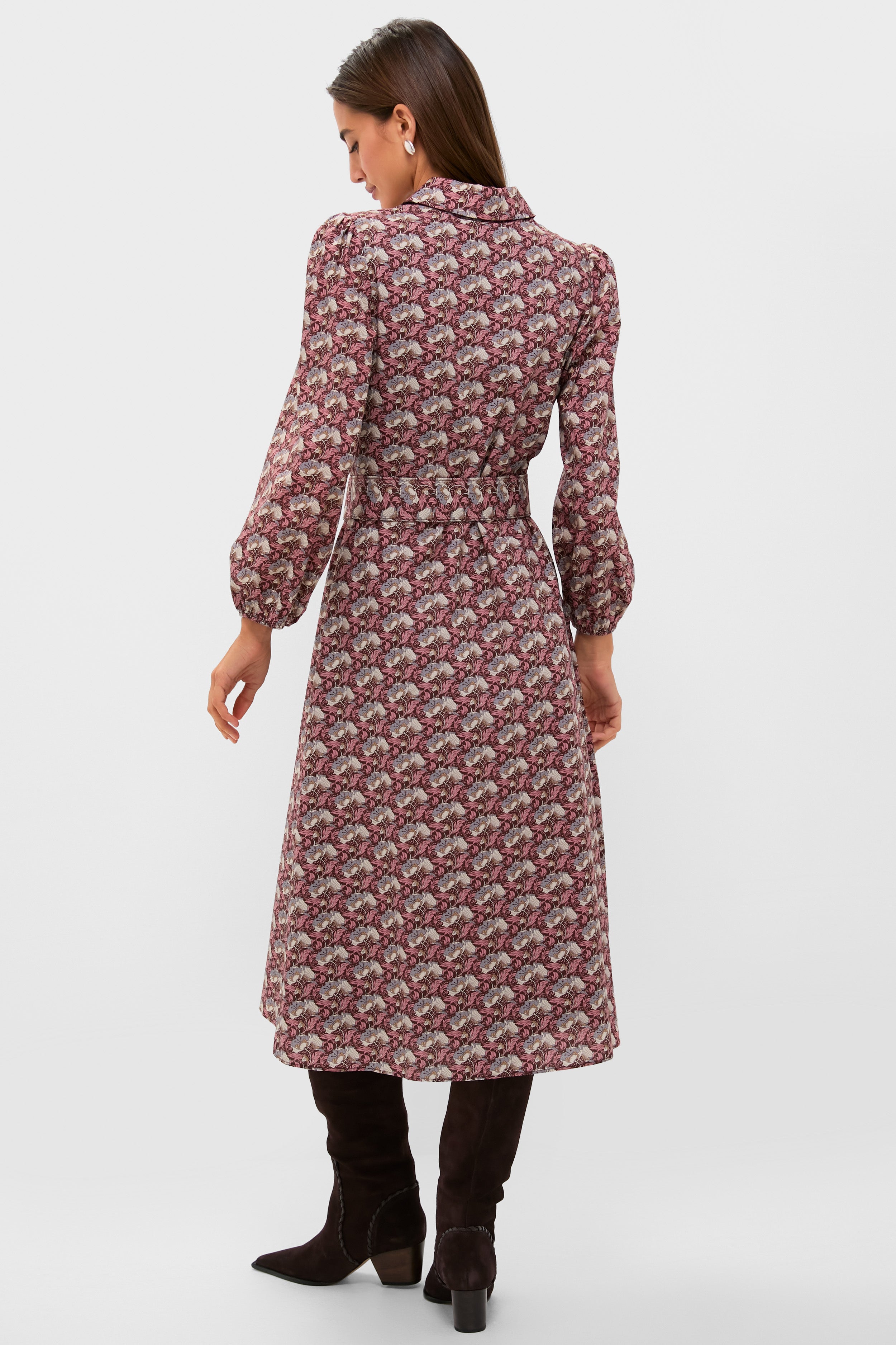 Woman wearing the classic Plum & Dusty Blue Leafy Floral Kai Maxi Dress with a fitted waist, fold-over collar, and knee-high boots, exuding effortless, high-end style.