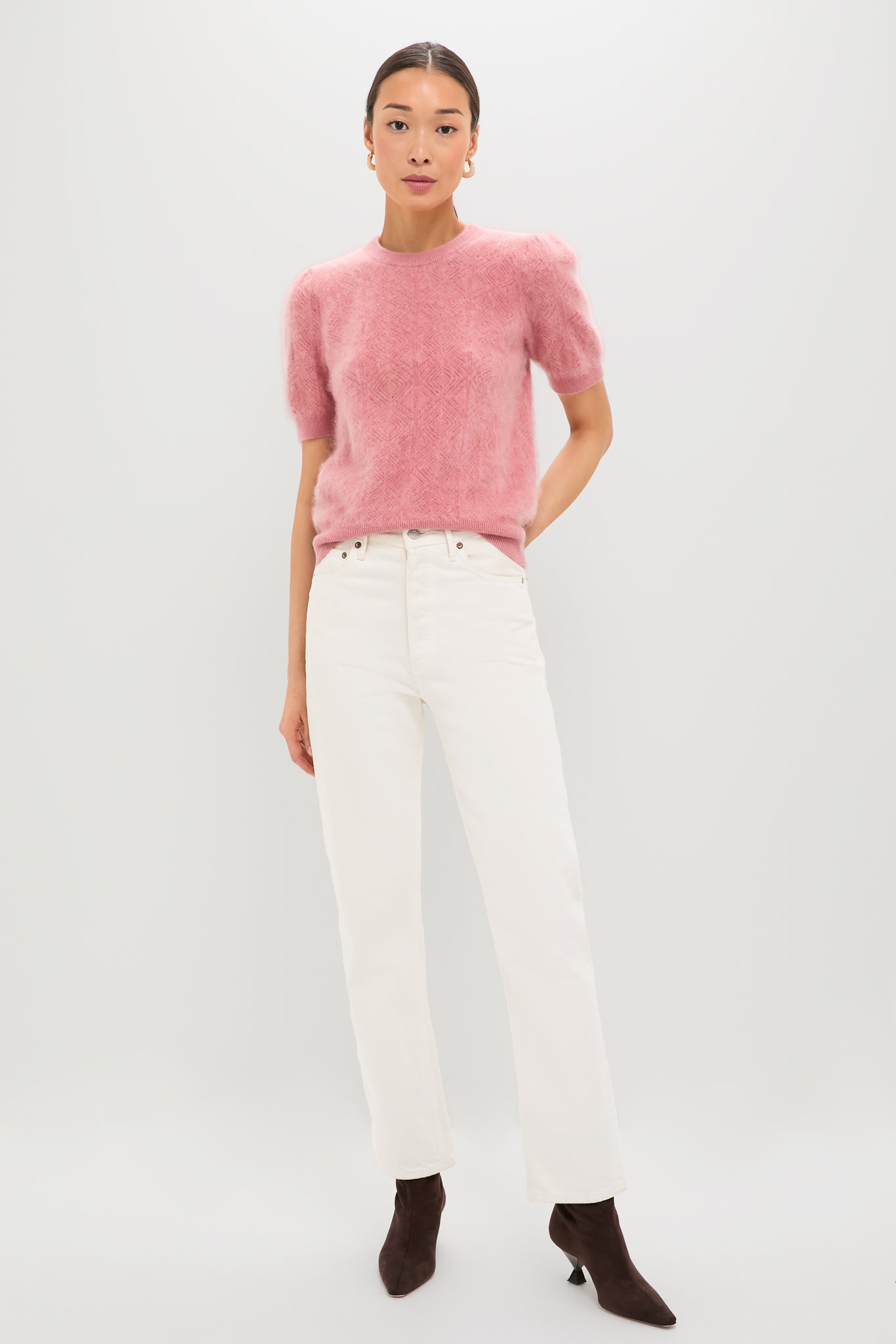 Person wearing the Dusty Rose Brushed Merino Wool Puff Sleeve Lexie Sweater, styled effortlessly with high-waisted jeans and ankle boots, embodying classic and high-end Tuckernuck fashion.