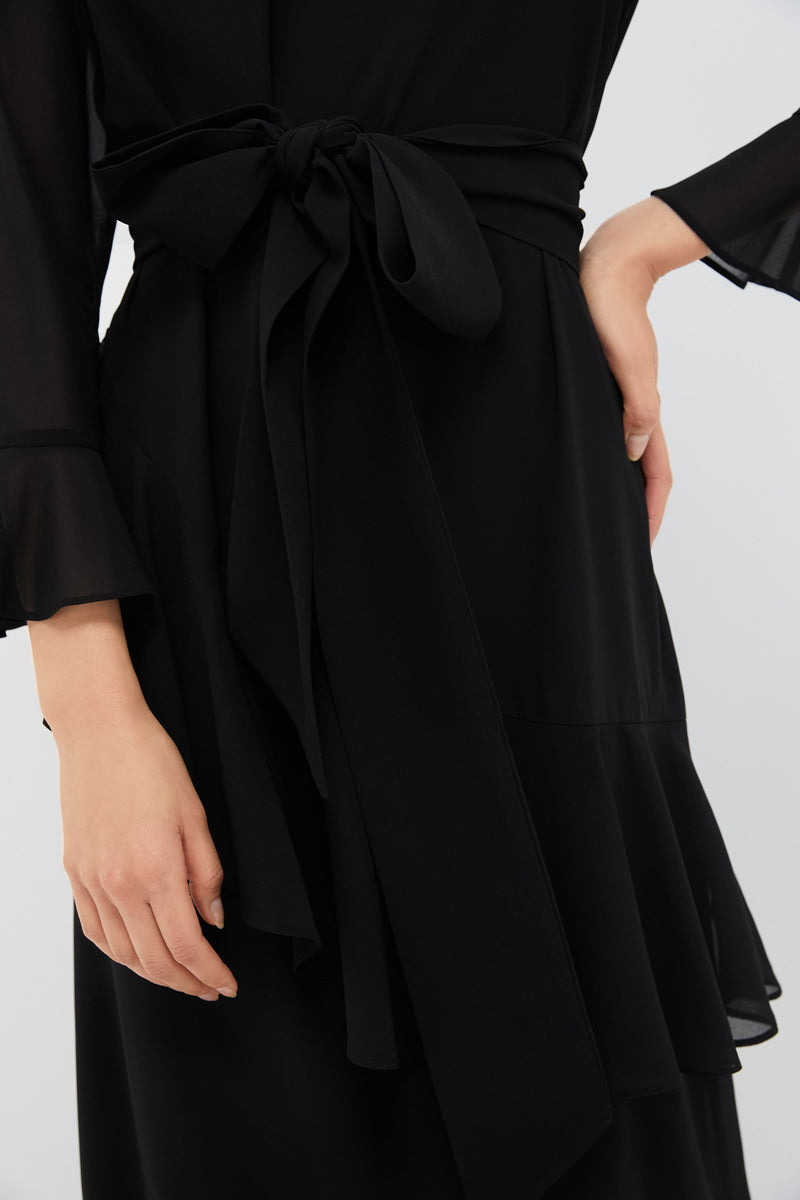 Black Chiffon Sasha Dress with tiered ruffles, sheer sleeves, and a self-tie waist belt, offering a classic, effortless, high-end look for any event.
