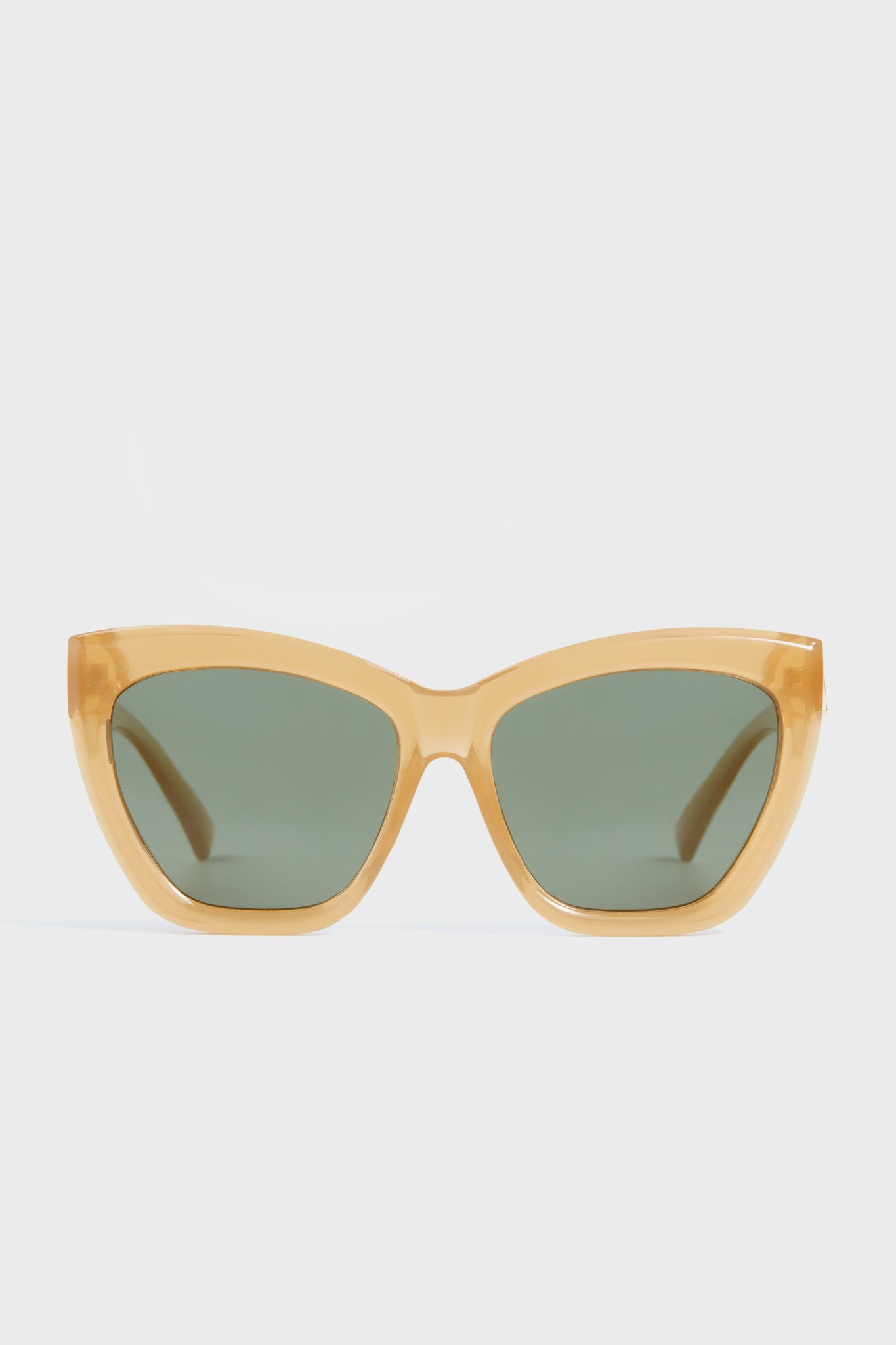 Le Specs thick-framed yellow cat-eye sunglasses with dark green polarized lenses.