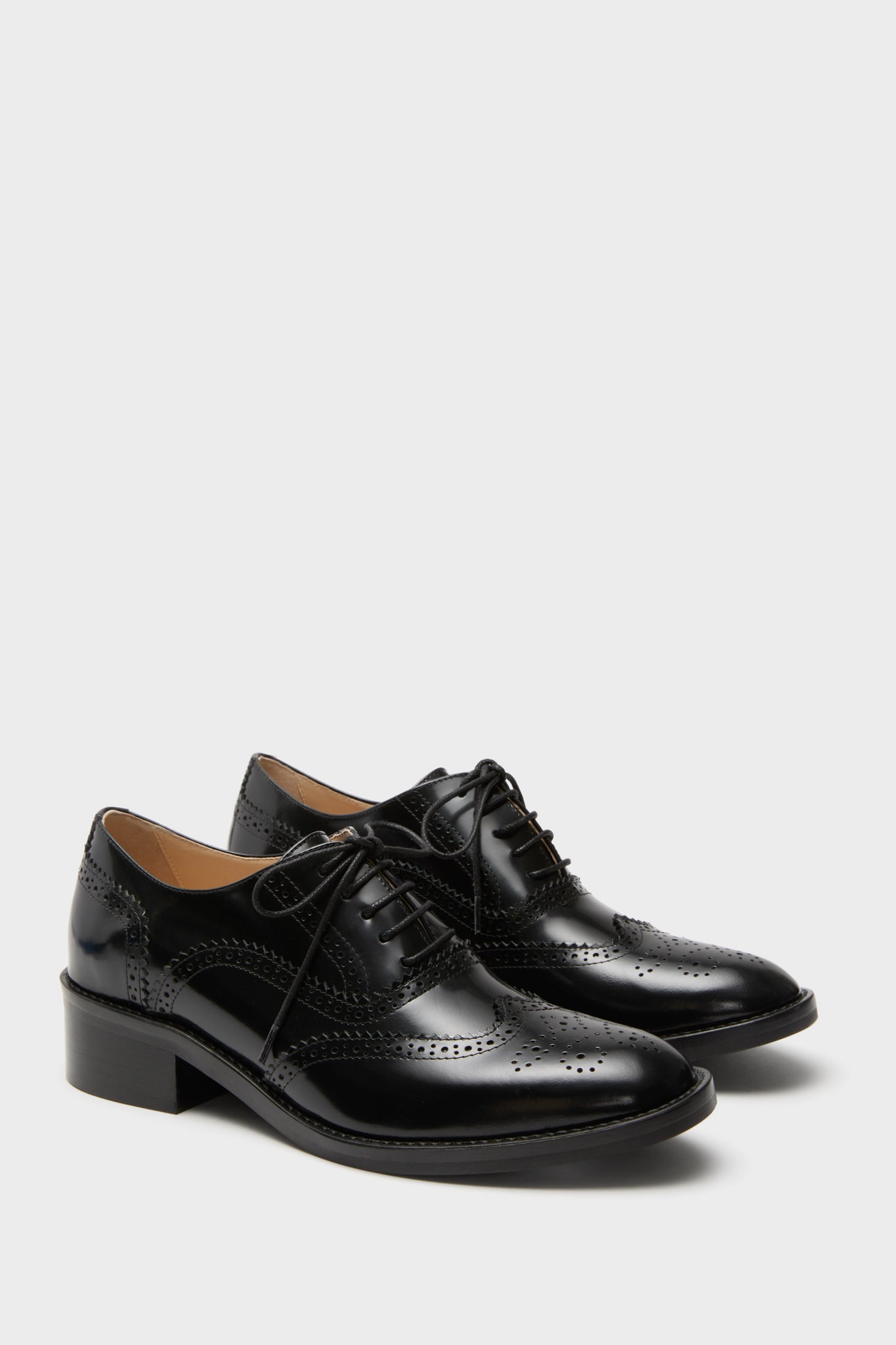 Black Leather Brogue Oxford Shoes with classic wingtip perforations and lace-up closure, offering an effortless, fun, and high-end look, perfect for versatile styling.