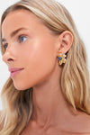 Woman's profile showcasing Gold Multi Lelani Stud Earrings with sculptural gold petals and a lapis center, blending classic elegance and modern edge for an effortless, high-end look.