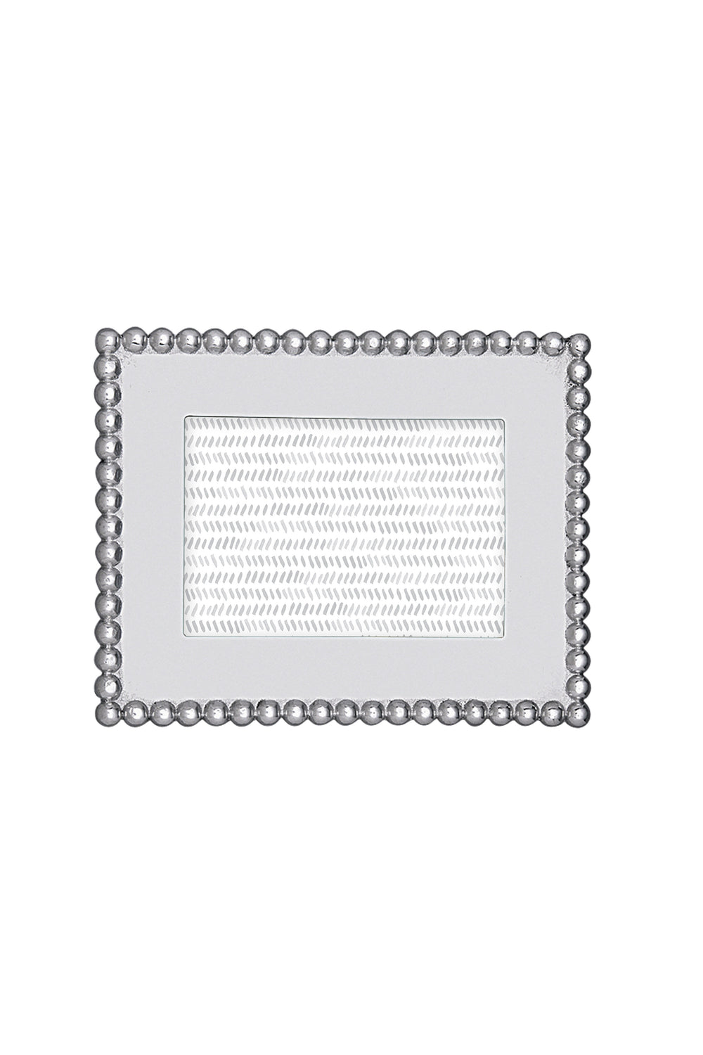 The Mariposa rectangular silver recycled aluminum frame features a beaded border and textured inner section, handcrafted for 4x6 photos—an ideal housewarming gift.