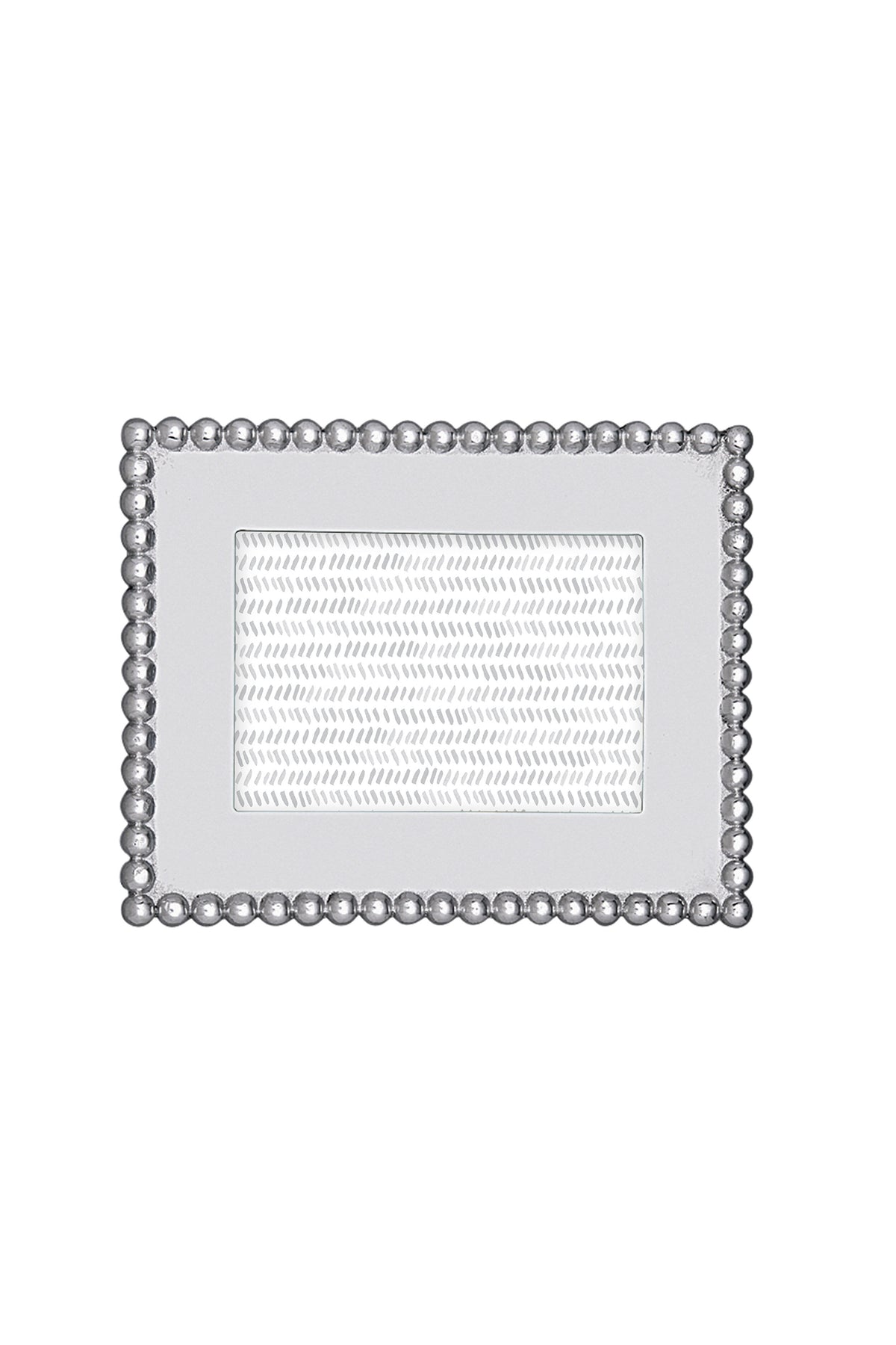 The Mariposa rectangular silver recycled aluminum frame features a beaded border and textured inner section, handcrafted for 4x6 photos—an ideal housewarming gift.