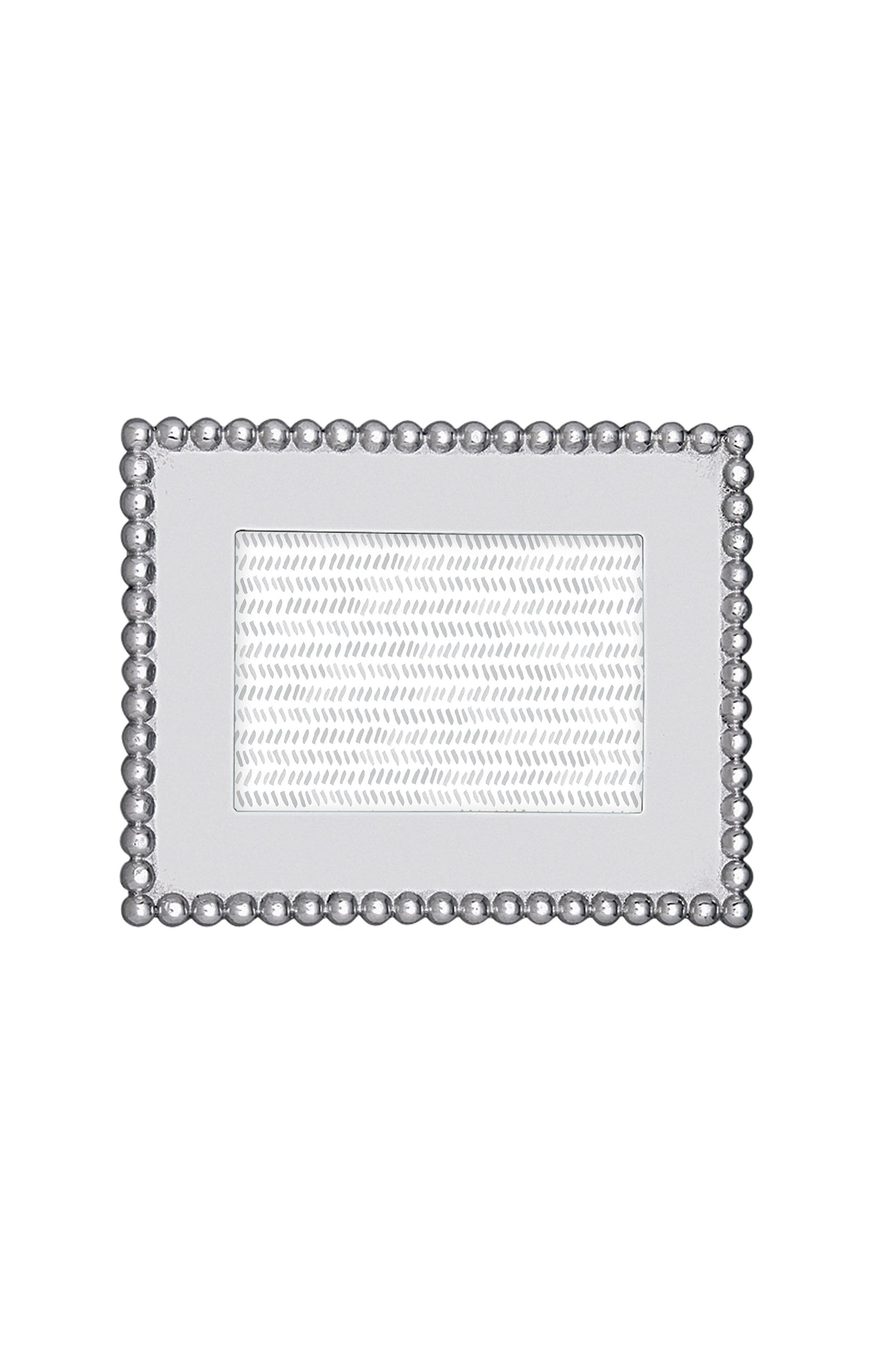 The Mariposa rectangular silver recycled aluminum frame features a beaded border and textured inner section, handcrafted for 4x6 photos—an ideal housewarming gift.