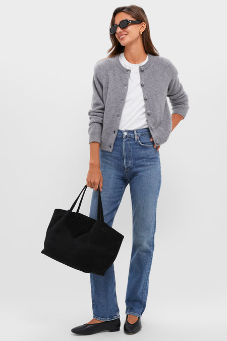 Model with Black Suede Blaine Tote, showcasing an effortless, high-end look with classic jeans and cardigan, emphasizing fun and practicality for everyday use.