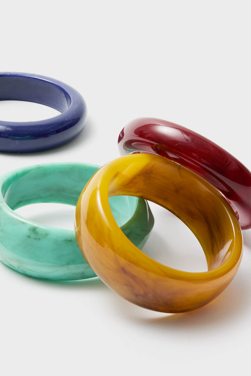 Oxblood and Tortoise Rita Bangle Set showcases classic, chunky resin bracelets, exuding effortless, high-end style and fun retro charm, perfect for any chic ensemble.