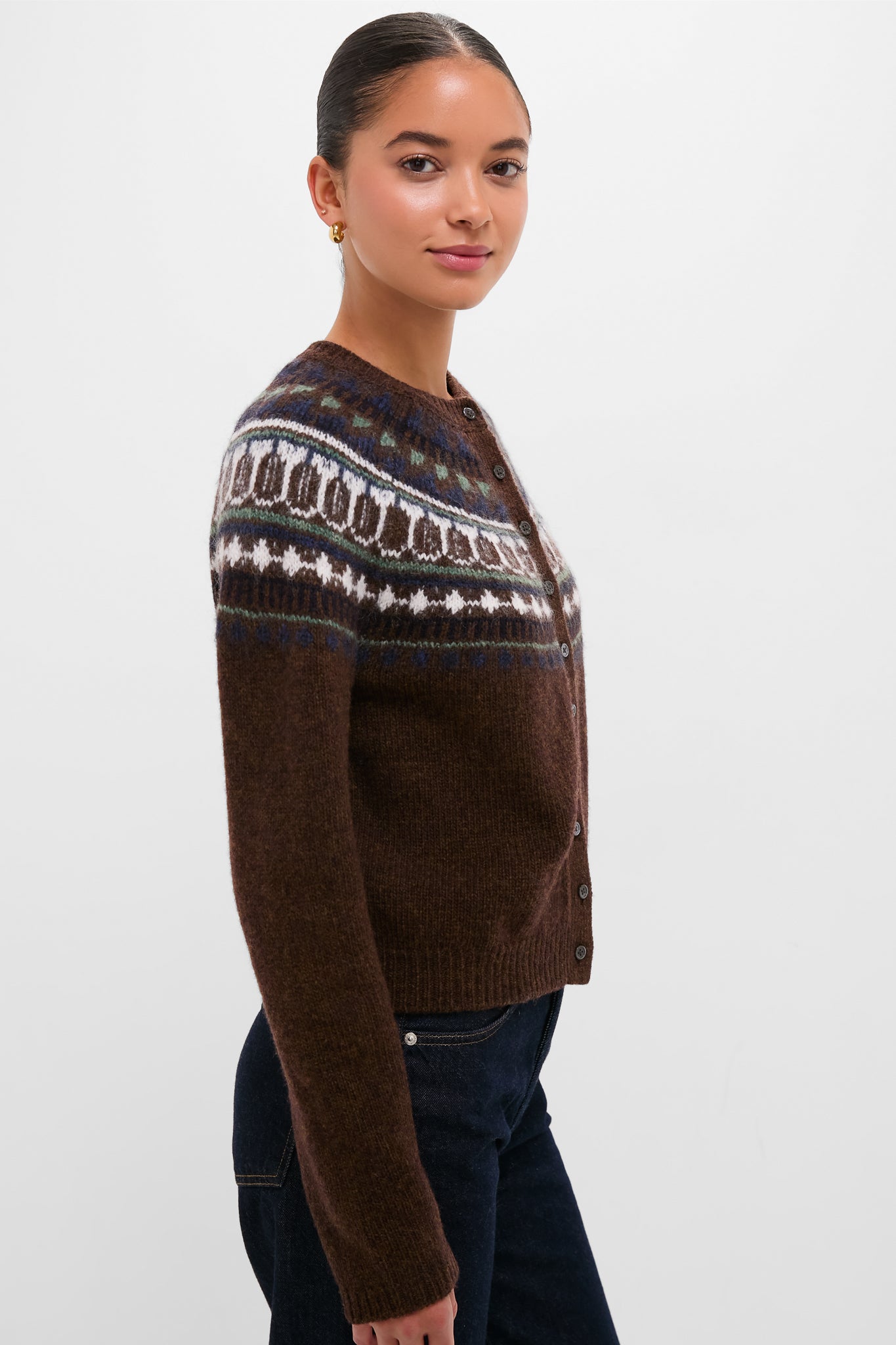 Young woman models the classic Chestnut Amina Fairisle Sweater, effortlessly styled with dark jeans; a high-end, fun piece reflecting Tuckernuck's cool, confident aesthetic.