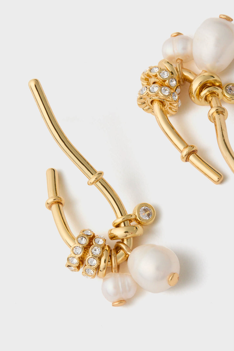 Pearl and Gold Charm Giselle Earrings feature classic gold hoops with lustrous pearls and crystal spacers, offering an effortlessly chic, fun, and high-end look.