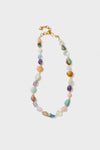 The Brinker + Eliza adjustable necklace showcases assorted polished semi-precious gemstones and gold chain links.