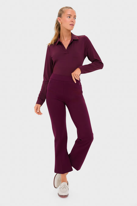 Model wearing Winetasting 28 Inch Compression September Pant, a classic, high-end, effortlessly stylish piece with side zip pockets and a slightly flared silhouette, paired with light-colored loafers.