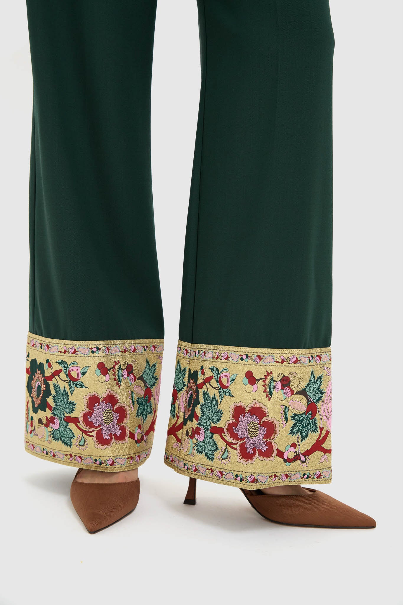 Model showcases Garden Scrollwork Jacquard Cuff Erin Pants, featuring classic wide-leg design with elegant floral jacquard trim, paired effortlessly with brown mules for a high-end look.