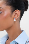 Sky Ines Earrings: classic two-part studs with a blue gemstone and pearl drop, offering effortless elegance and fun sophistication for high-end occasions.