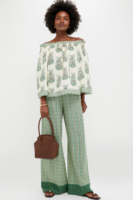 Model holding the classic Dark Brown Leather Sporty Lady Bag, showcasing its effortless, high-end style with a fun, sculptural silhouette and signature one-handle design.