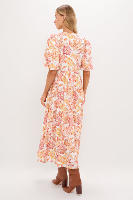 Saffron Floral Cisco Maxi Dress exudes classic elegance with its puff sleeves and flowy silhouette, effortlessly combining fun and high-end style for any occasion.