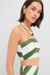 Young woman wearing the classic Green Stripe Nature Top, a cropped, spaghetti-strap bustier with green stripes, exuding an effortless and fun, high-end vibe.