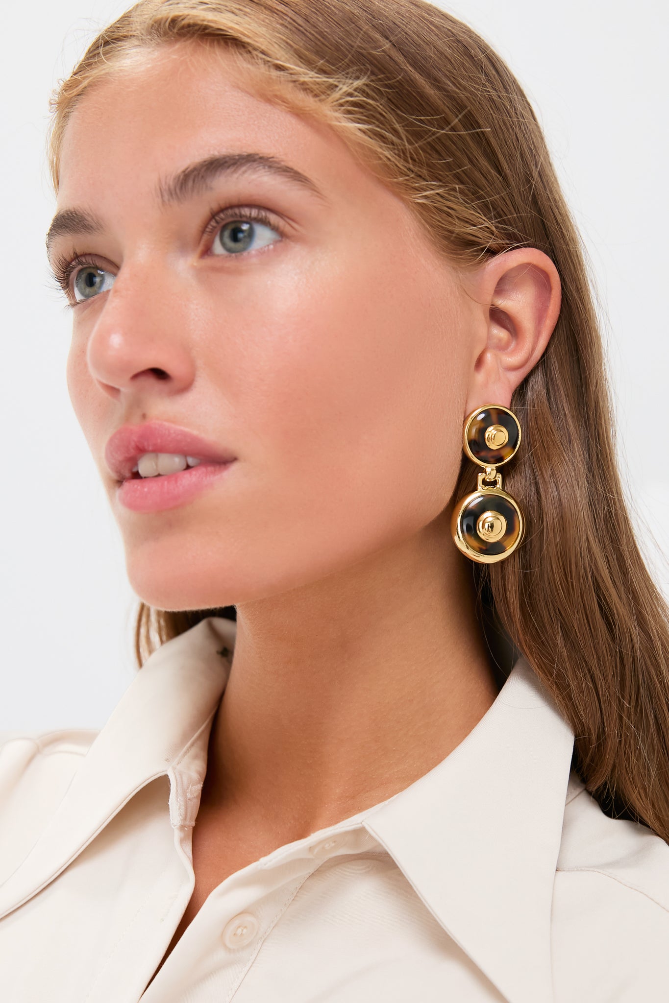 Close-up of a woman wearing Tortoise 24K Gold Electroplated Circle Drop Earrings, showcasing their classic, high-end design with effortless tortoise and gold detailing.