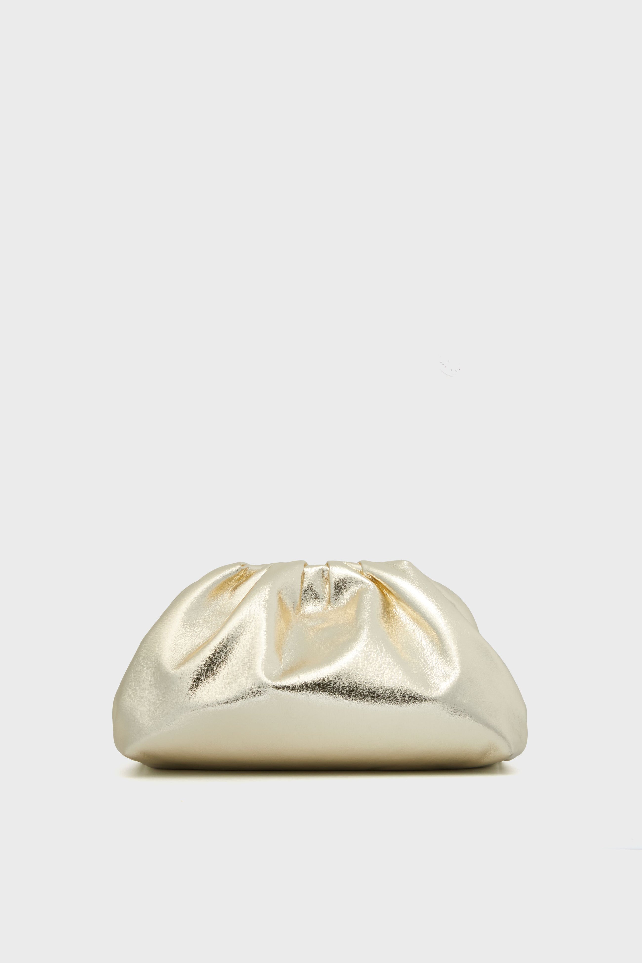 The Tuckernuck Accessories Gold Mini Slouchy Clutch features a metallic finish and ruched design, making it a stunning choice for evenings or weddings.
