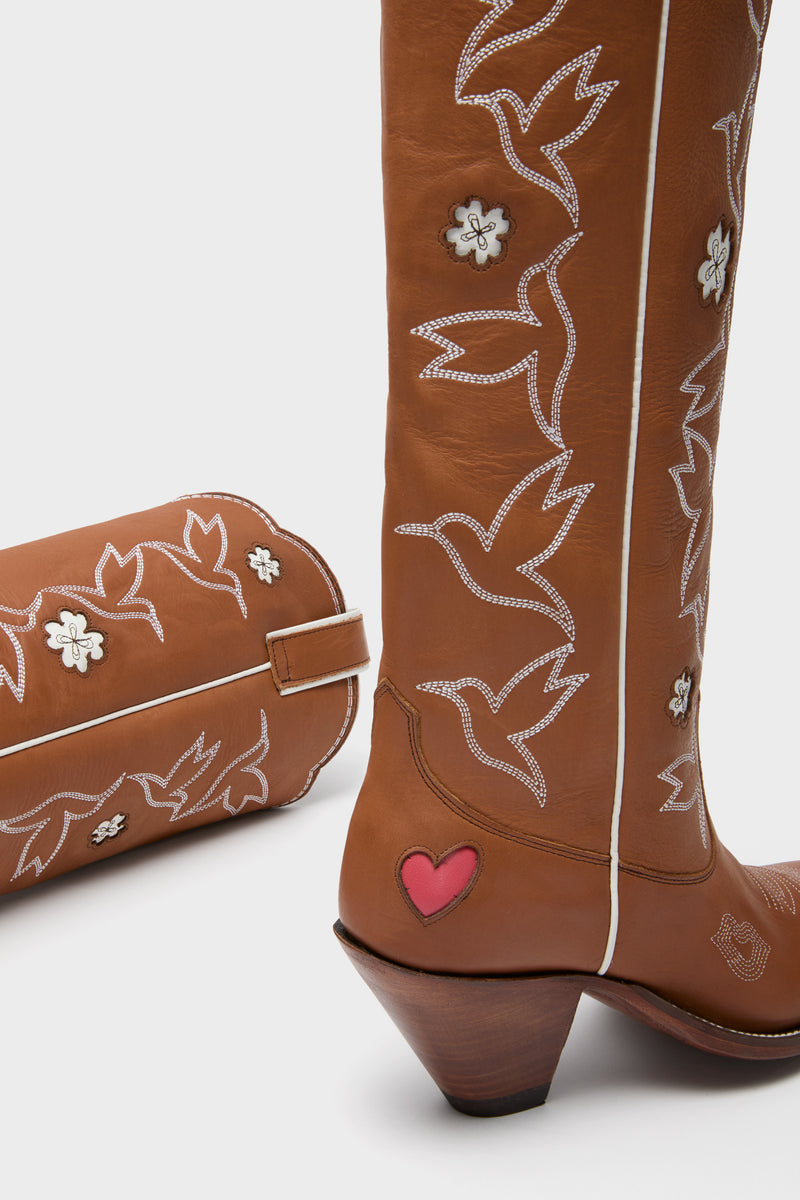 Sierra and White Honey Boots: Classic Western-style leather boots with effortless hummingbird and floral stitching, fun heart detail, and high-end scalloped topline.