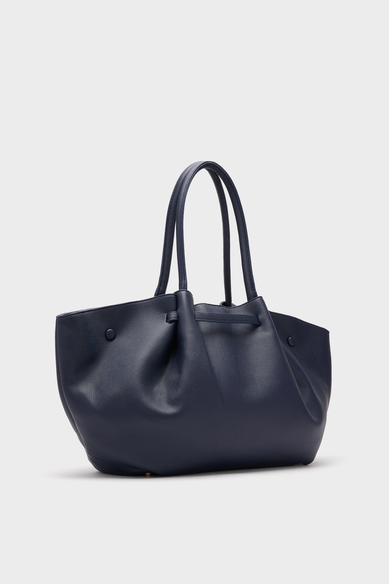 Urban Expressions vegan leather bag in dark blue with two handles, shown against a plain light background.